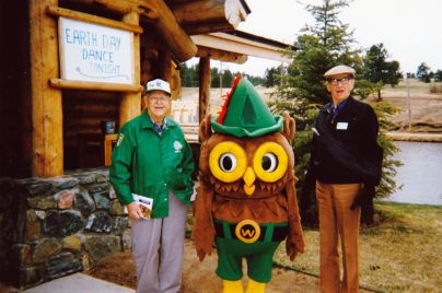 Chet Nolte, left, and Dick Henderson with Woodsy Owl at the Evergreen Earth Day Fair.